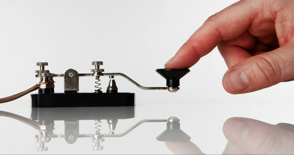 morse code key with someone sending a message